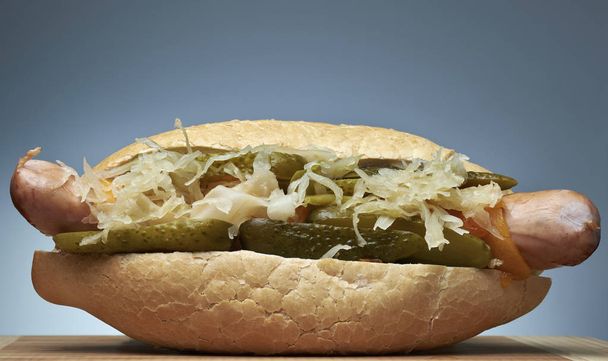 Hot Dog with pickles, melted cheddar cheese and Savoy cabbage - Photo, image