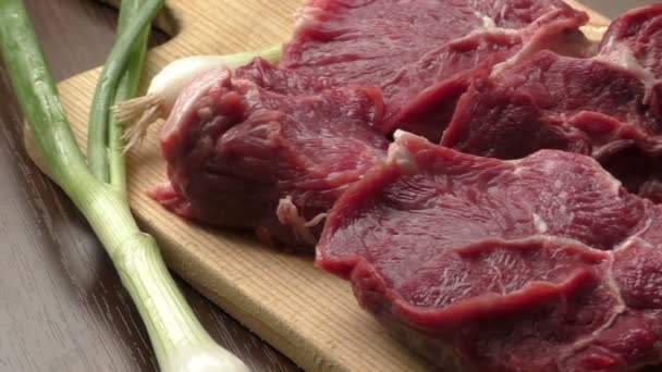 Fresh raw beef on wooden cutting plate - Footage, Video
