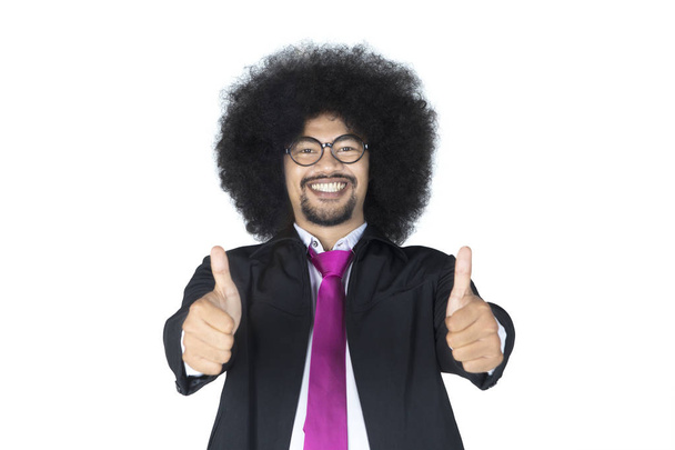 Afro businessman showing thumbs up - Foto, afbeelding