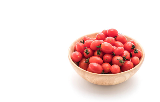 fresh tomatoes in wood bowl - 写真・画像