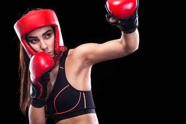 Female boxer in red glowes. Isolated on black background. - Foto, imagen