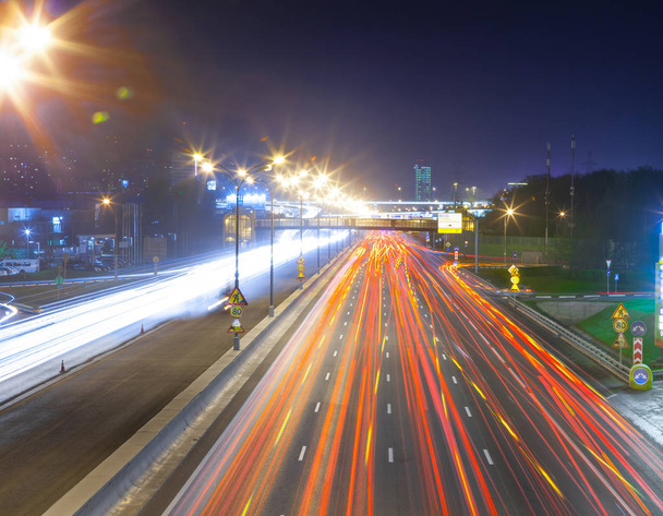 Urban city road with car light trails at nigh - Photo, Image