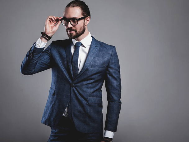 handsome fashion stylish hipster businessman model dressed in elegant blue suit  - Valokuva, kuva