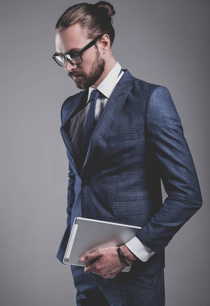 handsome fashion businessman  model dressed in elegant blue suit  - Fotó, kép