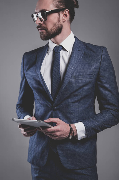 handsome fashion businessman  model dressed in elegant blue suit  - Foto, immagini
