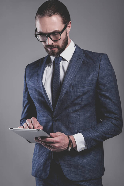 handsome fashion businessman  model dressed in elegant blue suit  - Фото, изображение