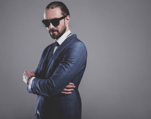 handsome fashion stylish hipster businessman model dressed in elegant blue suit  - Foto, Imagem