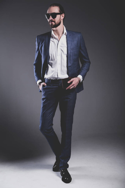 handsome fashion stylish hipster businessman model dressed in elegant blue suit  - Fotografie, Obrázek