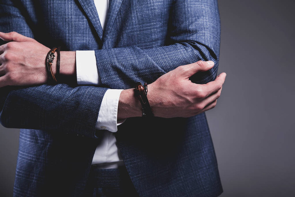 young businessman handsome model man dressed in elegant blue suit with accessories on hands  - Fotoğraf, Görsel