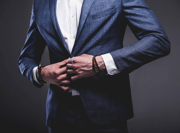 young businessman handsome model man dressed in elegant blue suit with accessories on hands  - Fotografie, Obrázek