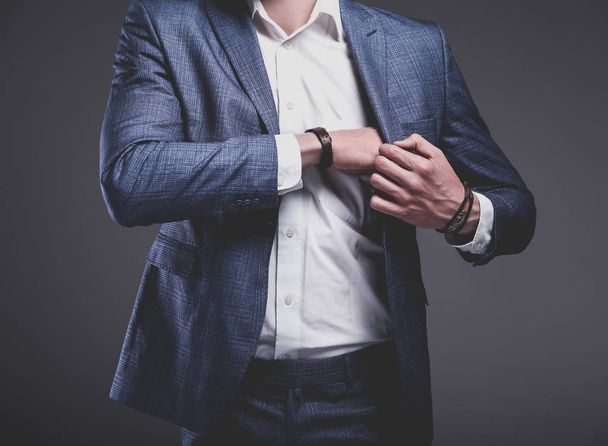 young businessman handsome model man dressed in elegant blue suit with accessories on hands  - Fotoğraf, Görsel