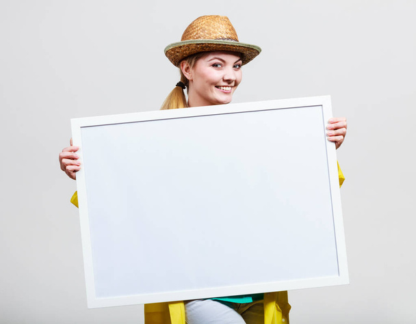 Happy cheerful woman holding blank white board - Photo, Image