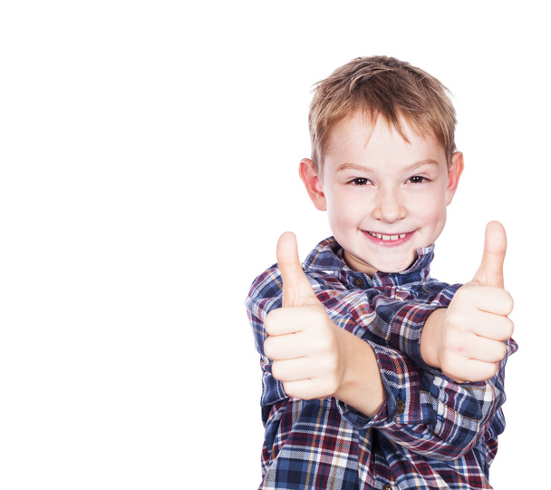 Boy with the thumbs up against a white background - Foto, immagini