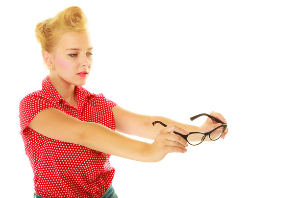 Blonde pin up girl holding retro glasses - Foto, immagini