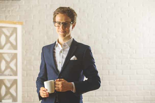Handsome businessman with coffee cup - Foto, Imagem