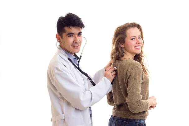 Doctor listening to womans back - Фото, зображення