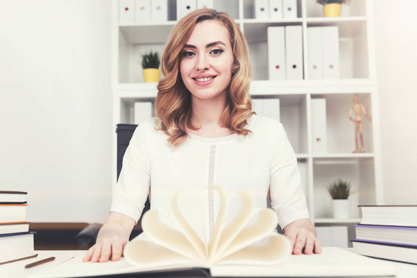 Smiling businesswoman with a book - Fotó, kép