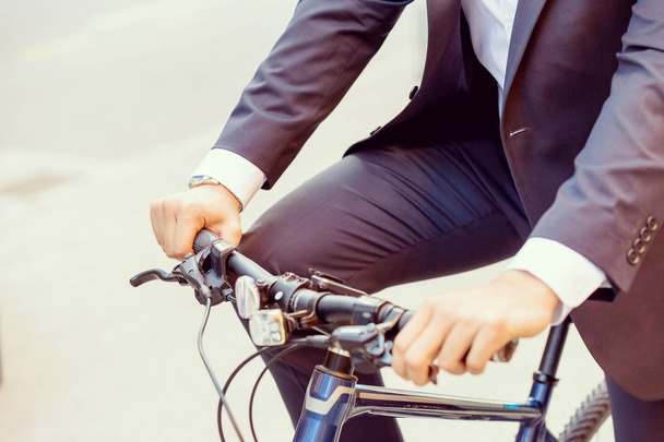 Successful businessman with bicycle - Фото, изображение