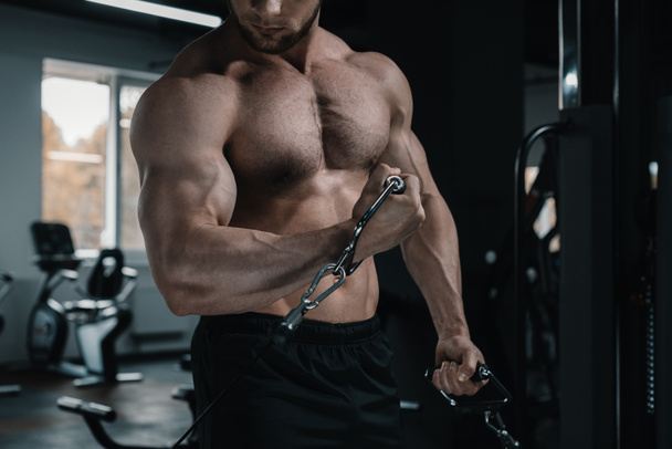 muscular sportsman working out  - Zdjęcie, obraz