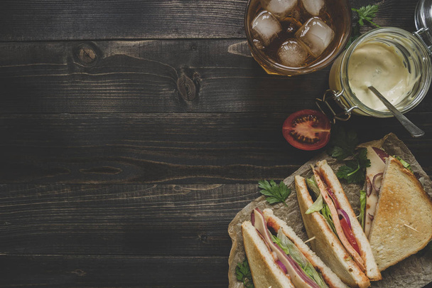 Fresh delicious club sandwich, sauces and drink on the wooden da - Foto, Imagem