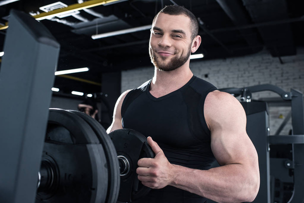 Muscular man in gym  - Photo, Image