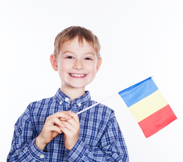 A little boy with romanian flag on the white background - Fotografie, Obrázek
