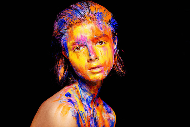 woman with colorful paint on face - Fotó, kép