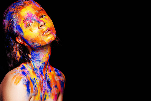 woman with colorful paint on face - Fotó, kép
