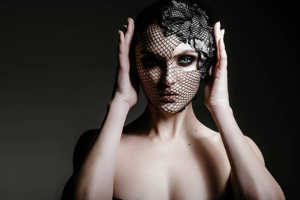 portrait of woman with black veil on face - Fotografie, Obrázek