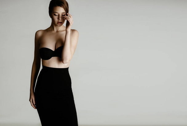 woman in black lingerie and skirt - Fotografie, Obrázek