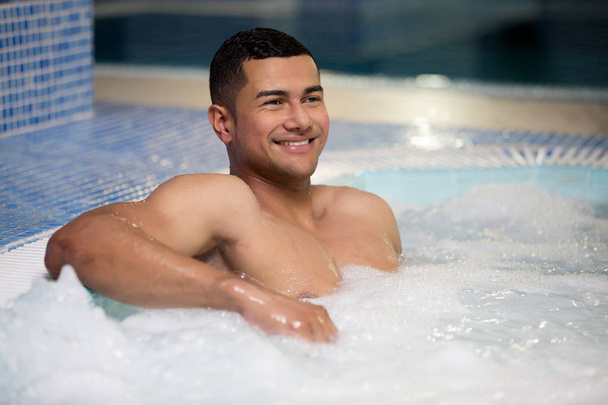 Happy man in pool - Photo, Image