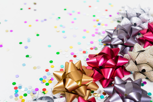Macro festive bows with confetti - Фото, изображение