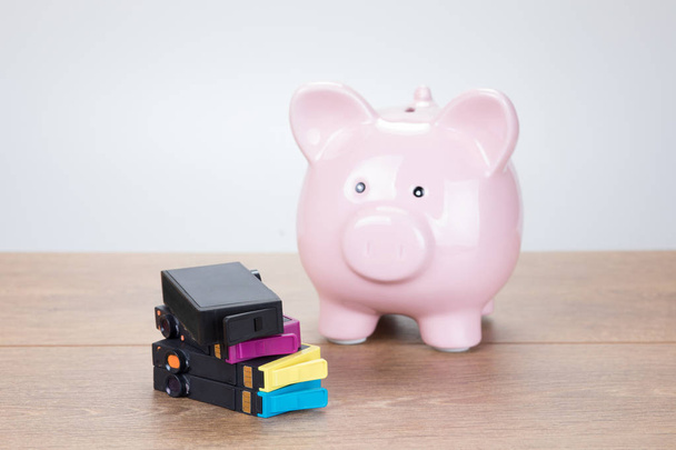 Ping piggy bank with empty printer ink cartridges - Photo, Image