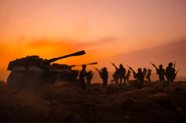 War Concept. Military silhouettes fighting scene on war fog sky background, World War Soldiers Silhouettes Below Cloudy Skyline At night. Attack scene. Armored vehicles. Tanks battle - Photo, image