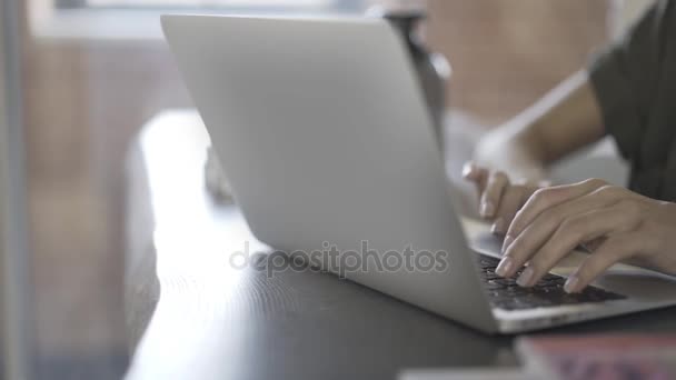Pan shot up of woman s hands typing and using touchpad - Кадри, відео
