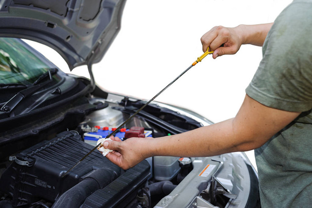 Car mechanic check oil level - Photo, Image