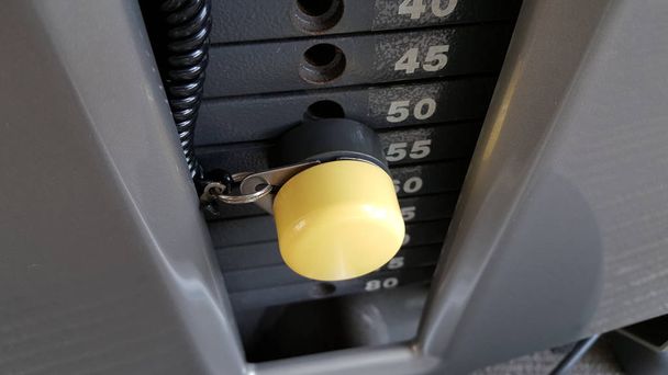 Gym weight plates with yellow pin. - Photo, Image