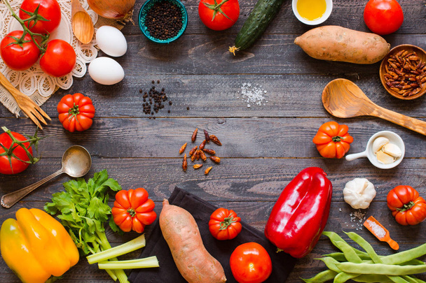 Different types of vegetables, on a old wooden table, space for  - Foto, Bild