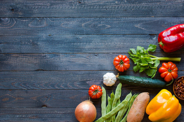 Different types of vegetables, on a old wooden table, space for  - Foto, Imagen