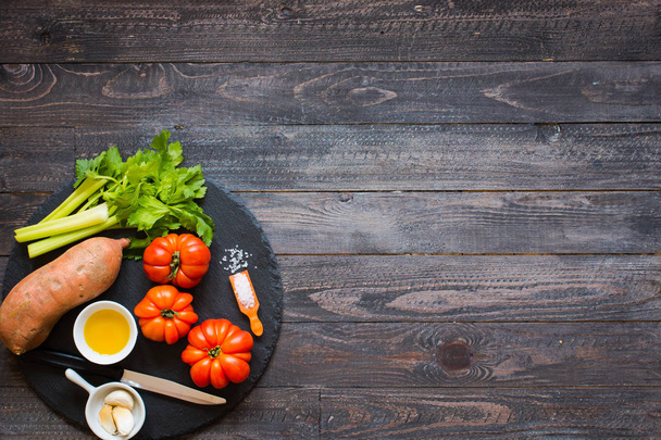 Different types of vegetables, on a old wooden table, space for  - Фото, зображення