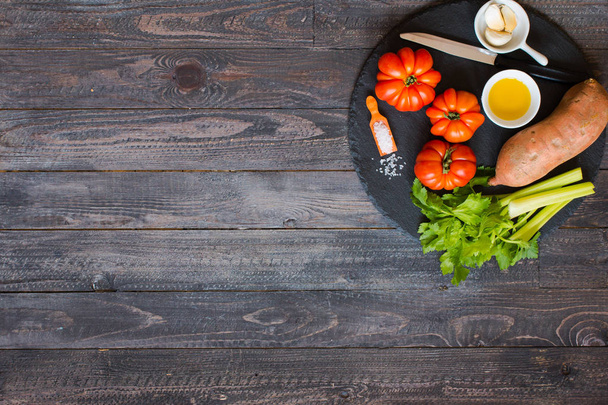 Different types of vegetables, on a old wooden table, space for  - Foto, afbeelding