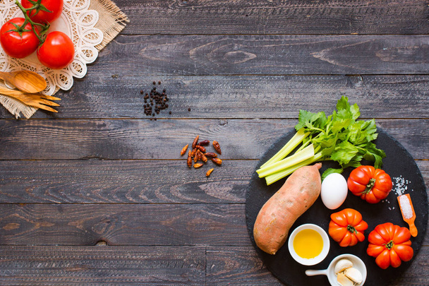 Different types of vegetables, on a old wooden table, space for  - Photo, Image