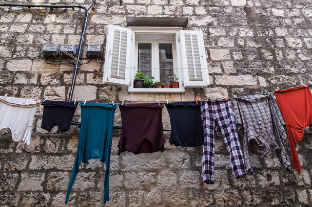 Colourful clothing out to dry - Фото, изображение
