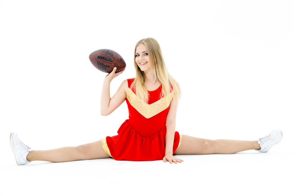 Cheerleader holding ball - Foto, immagini