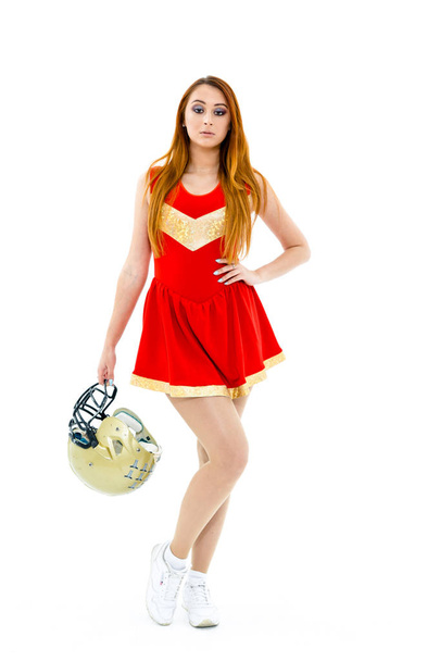 Cheerleader posing wih  helmet - 写真・画像
