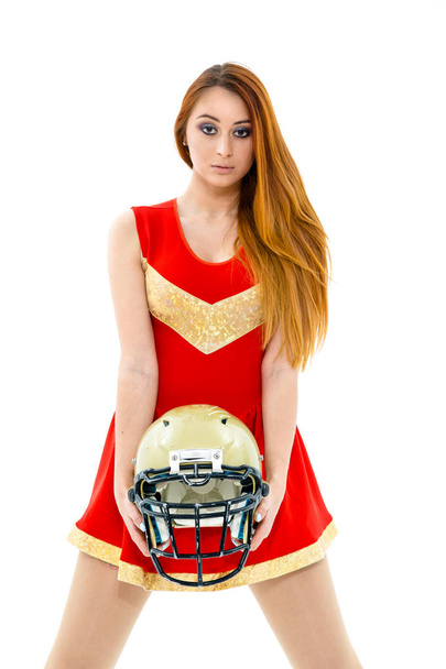 Cheerleader posing wih  helmet - Фото, изображение