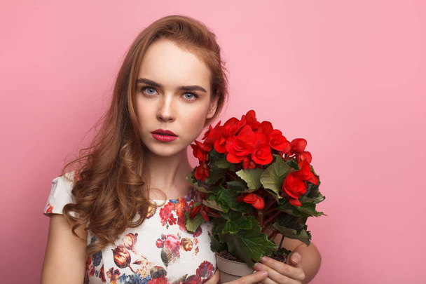 Beautiful model with flower pot - Foto, immagini