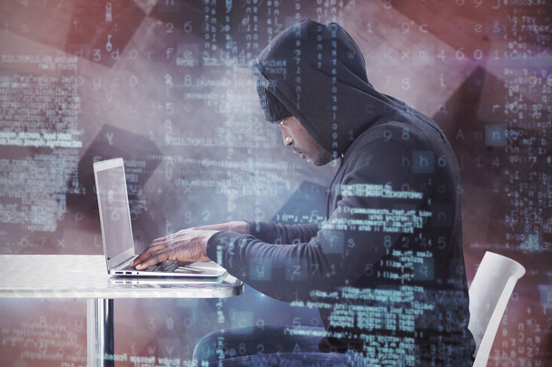 side view of male hacker using laptop  - Foto, afbeelding