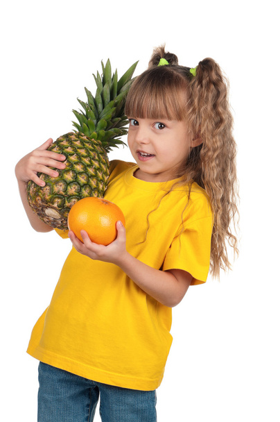 Little girl with pineapple - Photo, Image
