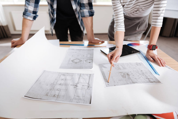 Close up of technical drawings lying on the table - Fotoğraf, Görsel